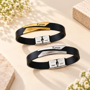 Personalized name bracelet with black band and custom gold and silver metal plates